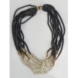 An 18.25" Hematite, untested Pearl and 9ct Gold Multi Strand Necklace, clasp hallmarked 147.5g