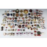 A large collection of metal and enamel lapel badges many relating to modern Olympic games