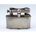 Dunhill, a plated table lighter, design No 737418, with engine turned decoration, 8cm long,