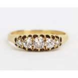 An 18ct Gold and Old Cut Diamond Five Stone Ring, largest stone c. 3.8mm, size N.25, 2.7g