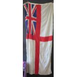 A Royal Navy White Ensign from HMS Venturer, marked "6 BD TH ENSIGN 5713299", 145 x 275cm.