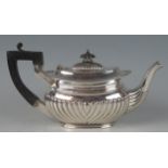 A Silver bachelor's oval teapot, maker George Unite, Birmingham, date letter worn, of oval form with