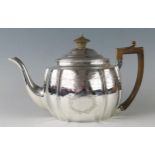 A George III silver barge-shaped teapot, maker Charles Fox I, London, 1805, monogrammed, with banded