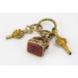 A 19th Century Gilt Metal and Carnelian Seal on a gilt jump ring with two watch keys