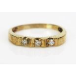 A 9ct Gold and Diamond Three Stone Ring, continental marks, stamped 21PT, size X.5, 2.94g
