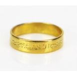 A 22ct Gold Wedding Band with chased scrolling decoration, London 1958, size L, 2.95g