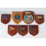 A collection of Wardroom badges and shipping line badges on shield-shaped plaques. (7)