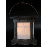 A late Victorian metal light, of cylindrical outline with lithophane panels of forest scenes, on a