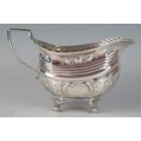 A George V silver cream jug, maker Charles Fox I, London, 1809, of barge-shaped outline, with basket