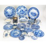 A collection of blue and white transfer print wares, including plates, tea bowls, tea pot,