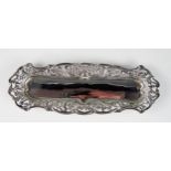 A late Victorian silver pin tray, maker James Deakin & Sons, Chester 1894, of rectangular outline,