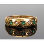 A Victorian Emerald and Diamond Five Stone Ring, c. 2mm central stone flanked by old cushion cuts,