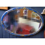 An oval wall mirror in the Chinoiserie taste the bevelled mirror plate enclosed by a blue
