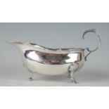 A George V silver sauce boat, maker Hamilton & Co, Birmingham, 1927, with wavy edge border, with