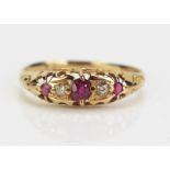 An 18ct Gold, Ruby and Cushion Cut Diamond Five Stone Ring, central stone c. 3.5mm, rubbed