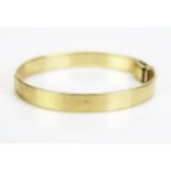 A 9ct Gold Hinged Child's Bangle, stamped 375, 39x36mm inside measurement, 9.27g