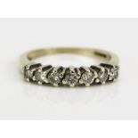 A 9ct White Gold and Diamond Half Eternity Ring, continental marks, .33ct, size K.5, 2.52g