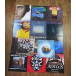 A collection of fourteen 33rpm records by various artists including Abba, Jean-Michel Jarre,