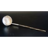 A Georgian silver toddy ladle, unmarked, the circular reeded bowl inset with George II sixpence,