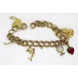 A 9ct Gold Charm Bracelet with pharaoh's bust, unmarked enamel strawberry and two others, 10.08g