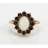 A 9ct Gold, Opal and Garnet Cluster Ring, hallmarked, 14x12.5mm head, 8x6mm singlet opal, size J,