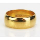 A Precious Yellow Metal Wedding Band, marked J. HAMNETT, KEE tested as 22ct, c. 7.8mm wide, size N.