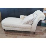 A Modern chaise longue, with stuff-over button down scroll end and side, with stuff-over seat