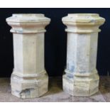 A Pair of Chimney Pots, 64cm high. One with loss to the base