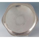 An Edward VII silver circular serving dish, maker Atkin Brothers, Sheffield, 1908, with wavy