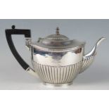 A Victorian silver teapot, maker James Deakin & Sons, Sheffield, 1897, crested and monogrammed, of
