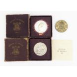A George VI 1937 Silver Crown and two boxed 1951 Festival of Britain crowns