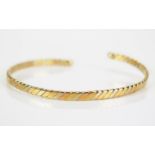 An 18ct Gold Tri-colour Bangle, stamped 750, 9.84g