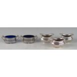 A set of three silver barge-shaped salts, all marks worn, with half reeded decoration, 6.5cm long,