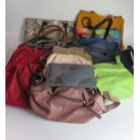 A collection of assorted ladies handbags, clutch bags, purses etc