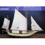 A model of a twin masted Bostonian fishing boat, "Spray", with painted two tone wood hull, with
