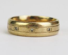 A Gent's 9ct Gold and Diamond Three Stone Band, 6mm wide, size S.5, 6.37g