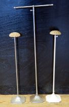 Two vintage adjustable hat stands, together with an adjustable scarf stand. (3)