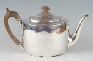 A George III silver oval teapot, maker William Bennett, London, 1805, initialled, of plain form,
