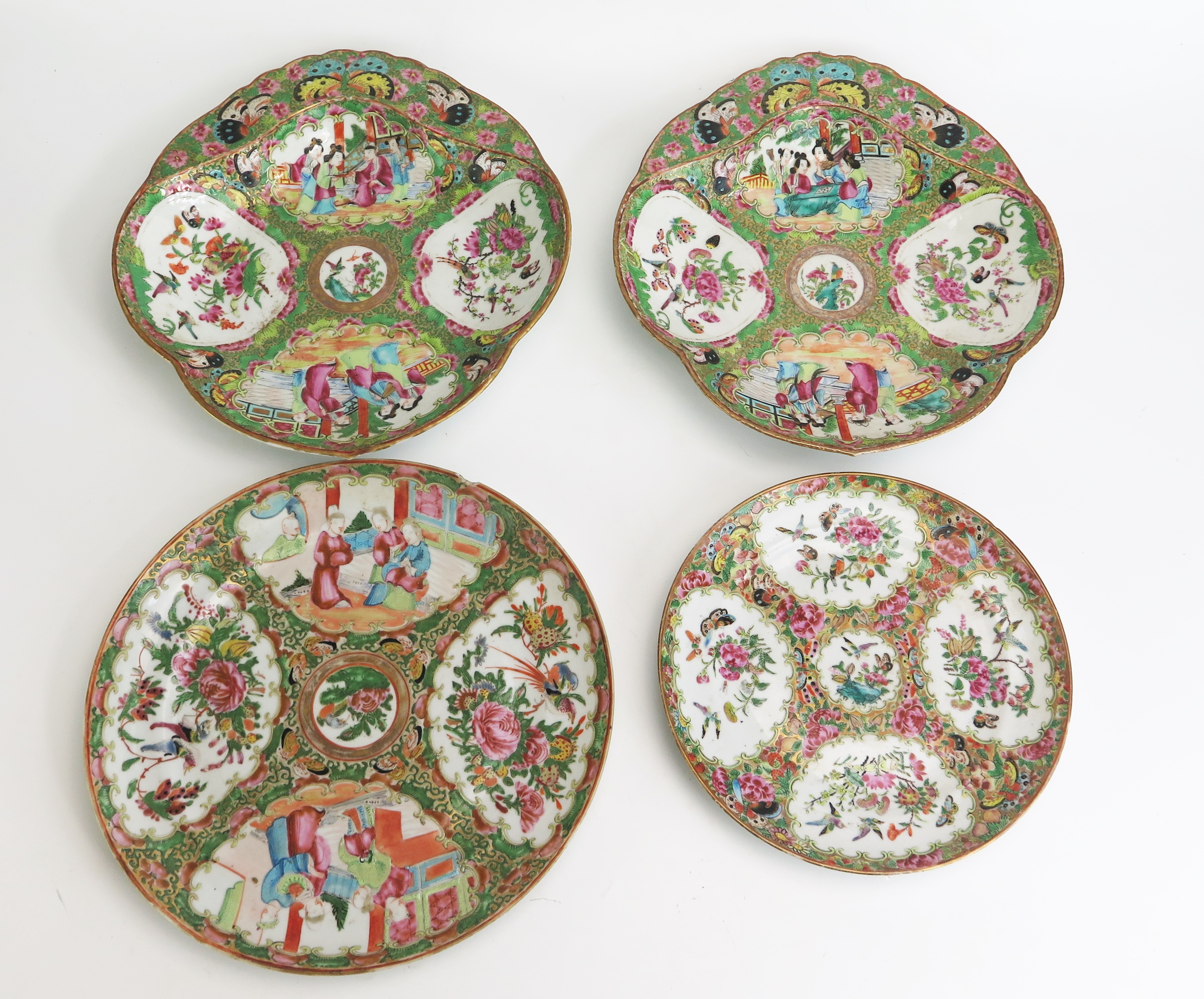 A pair of Chinese famille verte serving dishes of shell-shaped outline with panels decorated with