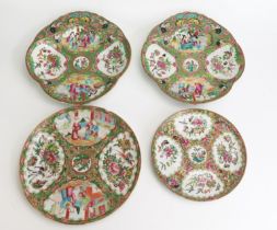 A pair of Chinese famille verte serving dishes of shell-shaped outline with panels decorated with