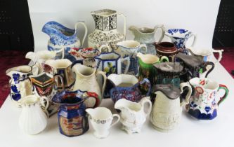 A collection of assorted Victorian and later jugs, including moulded cordial jugs, milk and water