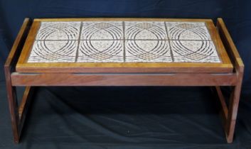 A vintage teak coffee table, the rectangular tiled top on square shaped supports, 98cm wide.