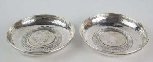 A pair of Persian silver circular dishes inset with thalers, 10cm diameter, 153gms, 4.93ozs