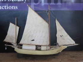 A model of a twin masted Bostonian fishing boat, "Spray", with painted two tone wood hull, with