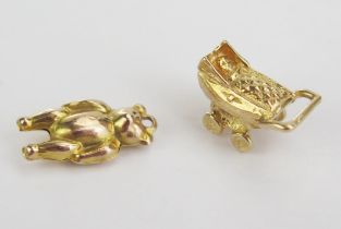 A 9ct Gold Teddy Bear Charm and a 9ct gold pram charm, both hallmarked, 2.2g