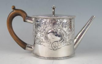 A George III silver cylindrical teapot, maker William Vincent, London, 1775, initialled, with flat