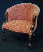 A carved mahogany salon chair with upholstered padded back, stuff-over seat of serpentine outline,