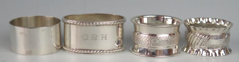 Four assorted silver napkin rings, various makers and dates, total weight of silver 107gms, 3.46ozs