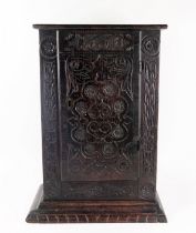 An antique oak table top cabinet, with plain top and associated carved panel door dated 1668,