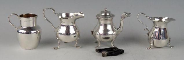 Three small cream jugs, various makers and dates, together with a miniature continental silver